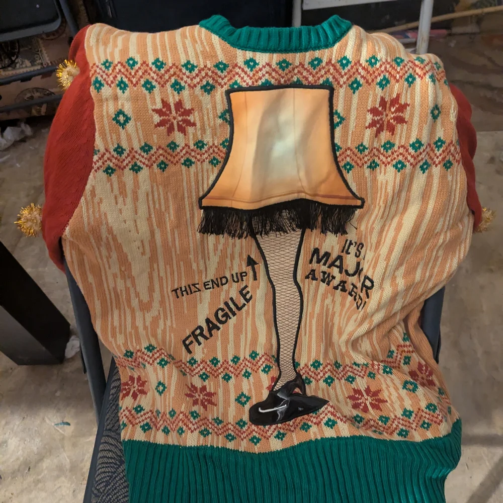 Spencer's Holiday Blanket with Light-Up Leg Lamp Design